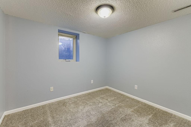 11570 Juniper St NW, Coon Rapids, MN 55448 - carpeted empty room with a textured ceiling and baseboards