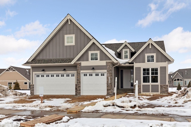 craftsman-style house featuring stone siding, board and batten siding, and roof with shingles