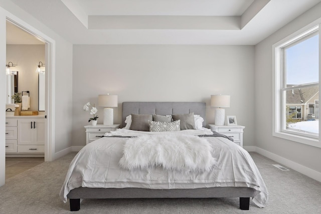 bedroom with light colored carpet, visible vents, and baseboards