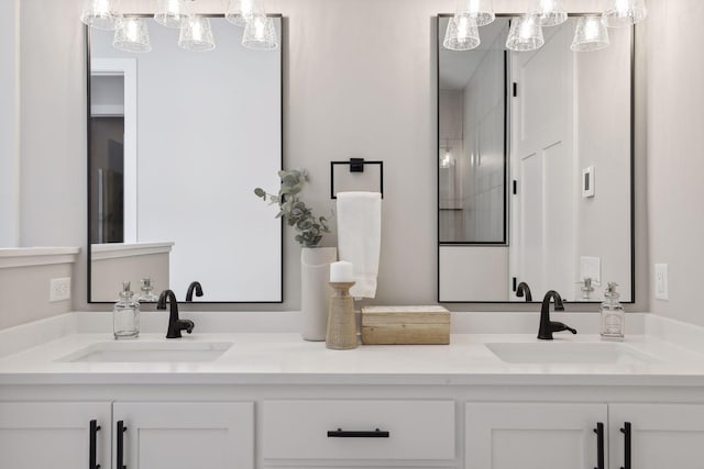 bathroom with double vanity and a sink