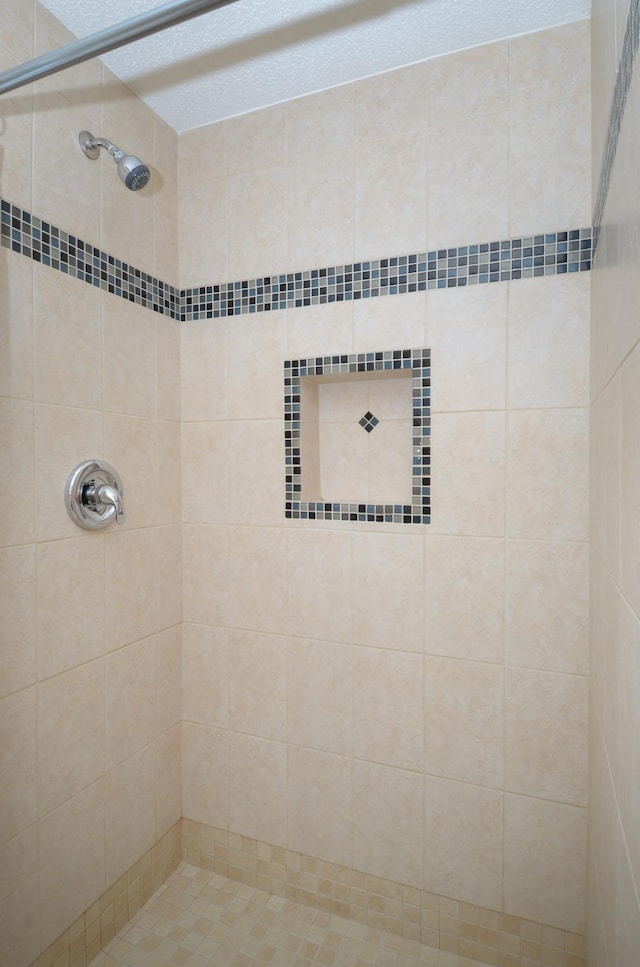 full bath featuring a shower stall