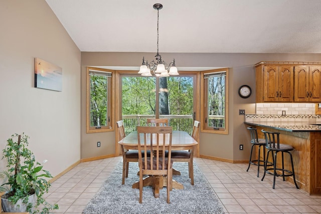 3415 197th Ave NW, Oak Grove, MN 55303 - dining space featuring light tile patterned floors, a chandelier, and baseboards