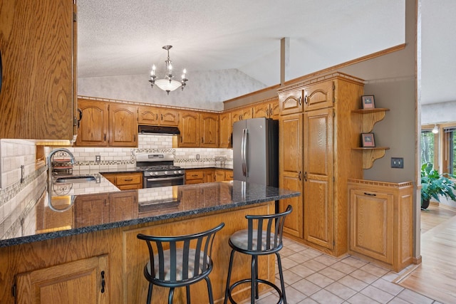 3415 197th Ave NW, Oak Grove, MN 55303 - kitchen featuring stainless steel appliances, under cabinet range hood, a sink, tasteful backsplash, and a peninsula