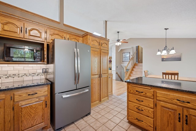3415 197th Ave NW, Oak Grove, MN 55303 - kitchen featuring freestanding refrigerator, vaulted ceiling, a chandelier, light tile patterned flooring, and ceiling fan