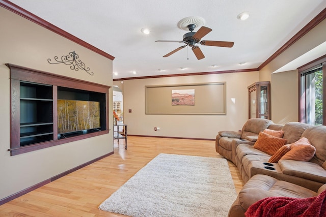 3415 197th Ave NW, Oak Grove, MN 55303 - living area with crown molding, a ceiling fan, wood finished floors, baseboards, and recessed lighting
