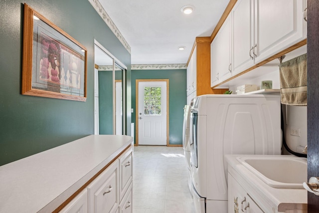 3415 197th Ave NW, Oak Grove, MN 55303 - washroom featuring cabinet space, separate washer and dryer, recessed lighting, and light flooring