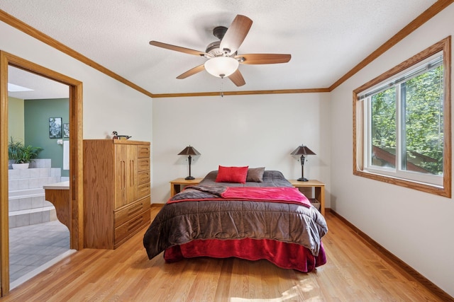 3415 197th Ave NW, Oak Grove, MN 55303 - bedroom featuring wood finished floors, a textured ceiling, crown molding, ceiling fan, and baseboards