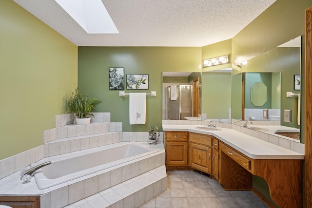 3415 197th Ave NW, Oak Grove, MN 55303 - bathroom featuring a skylight, a shower stall, vanity, a garden tub, and tile patterned floors