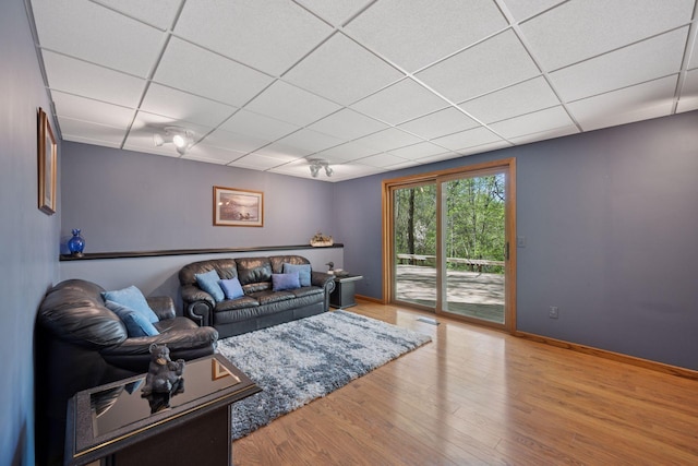 3415 197th Ave NW, Oak Grove, MN 55303 - living room with a paneled ceiling, wood finished floors, and baseboards