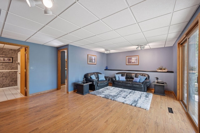 3415 197th Ave NW, Oak Grove, MN 55303 - living room with a drop ceiling, wood finished floors, plenty of natural light, and baseboards