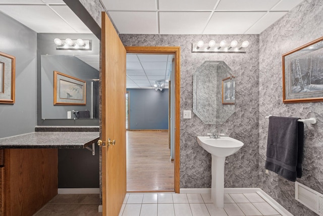 3415 197th Ave NW, Oak Grove, MN 55303 - bathroom featuring a paneled ceiling, baseboards, and tile patterned flooring