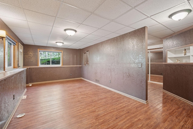 3415 197th Ave NW, Oak Grove, MN 55303 - unfurnished room featuring a paneled ceiling, wood finished floors, baseboards, and a textured wall