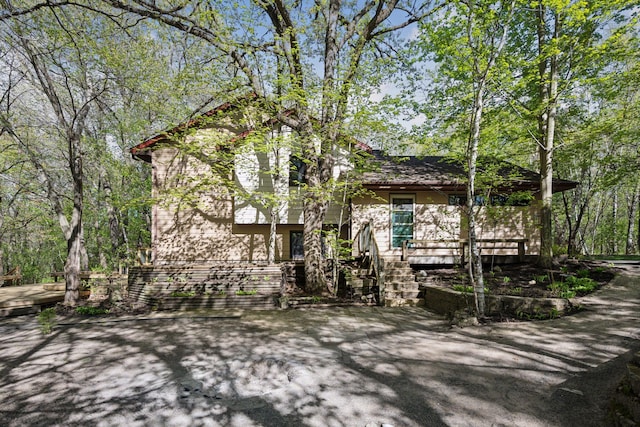 3415 197th Ave NW, Oak Grove, MN 55303 - view of property hidden behind natural elements featuring covered porch