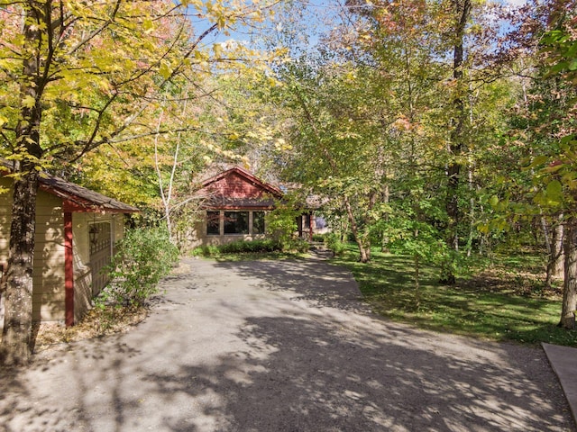 3415 197th Ave NW, Oak Grove, MN 55303 - view of property hidden behind natural elements with asphalt driveway