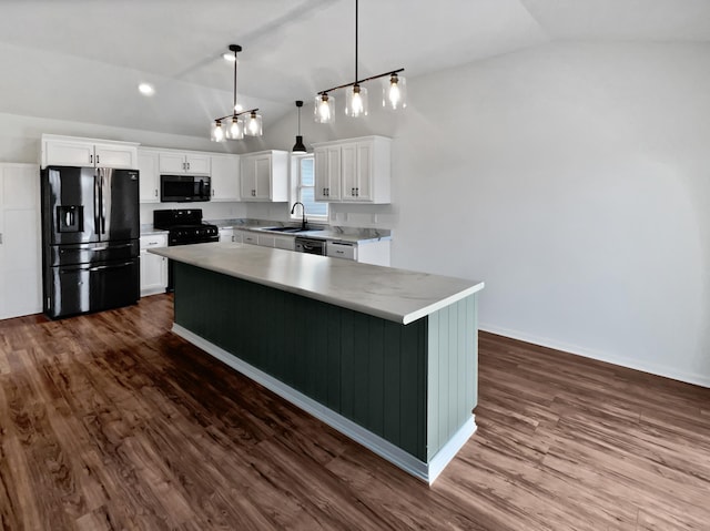 kitchen with dark wood-style flooring, lofted ceiling, white cabinets, a sink, and black appliances