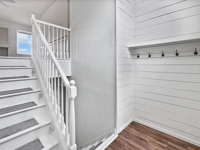 stairs featuring baseboards and wood finished floors