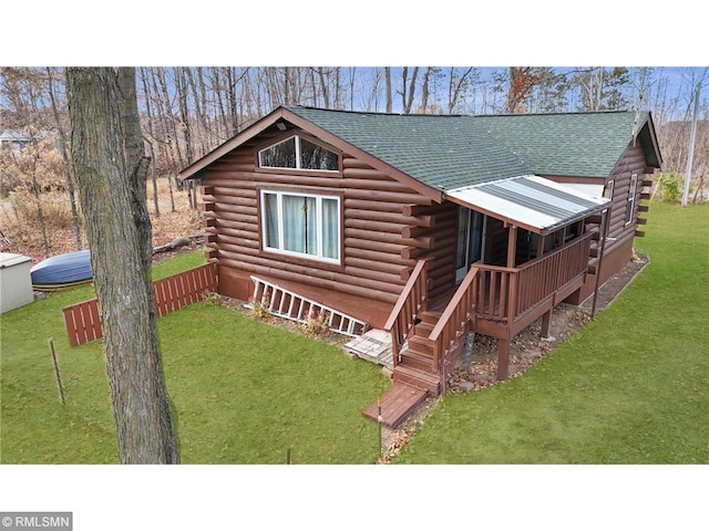 734 180th Ave, Apple River Twp, WI 54810 - view of front facade featuring log siding and a shingled roof