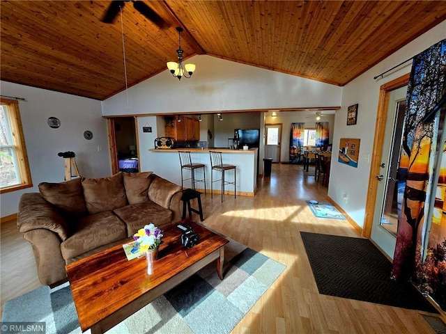 734 180th Ave, Apple River Twp, WI 54810 - living area with wood ceiling, vaulted ceiling, wood finished floors, a chandelier, and plenty of natural light