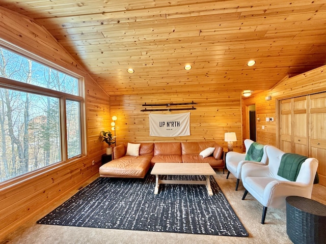 carpeted living room with lofted ceiling, wooden ceiling, and wooden walls