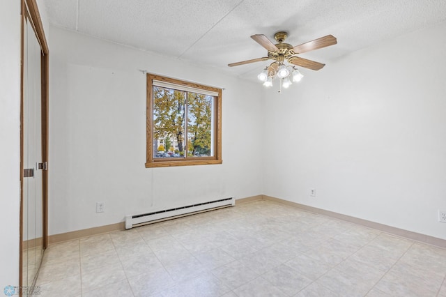 unfurnished room featuring baseboards, ceiling fan, a baseboard heating unit, and a textured ceiling