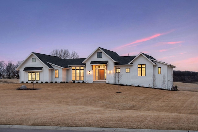 modern inspired farmhouse featuring board and batten siding