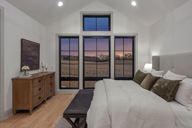 bedroom featuring high vaulted ceiling, recessed lighting, and light wood-style floors