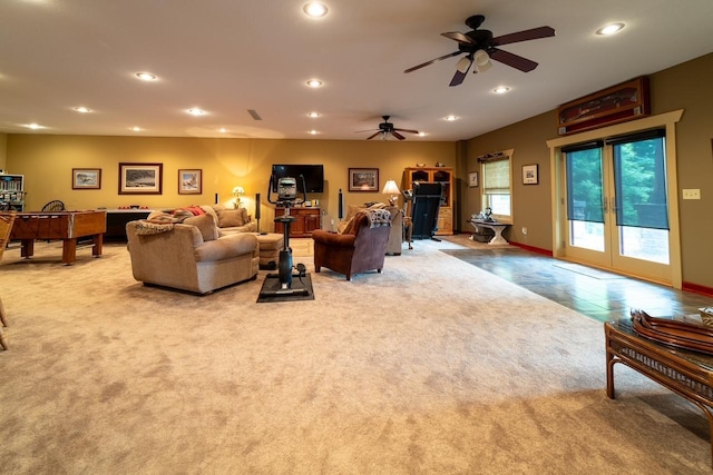 living room featuring light tile patterned floors, visible vents, baseboards, light colored carpet, and recessed lighting