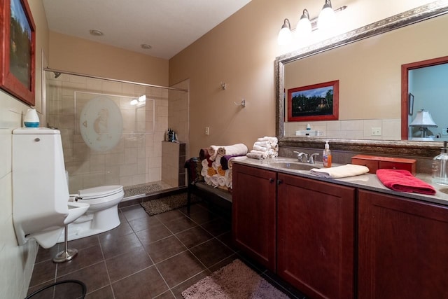 full bathroom with a stall shower, tile patterned flooring, vanity, and toilet