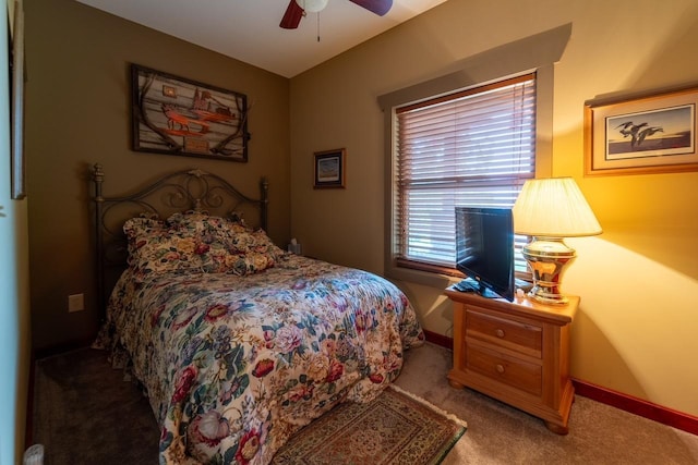 bedroom featuring carpet floors, a ceiling fan, and baseboards