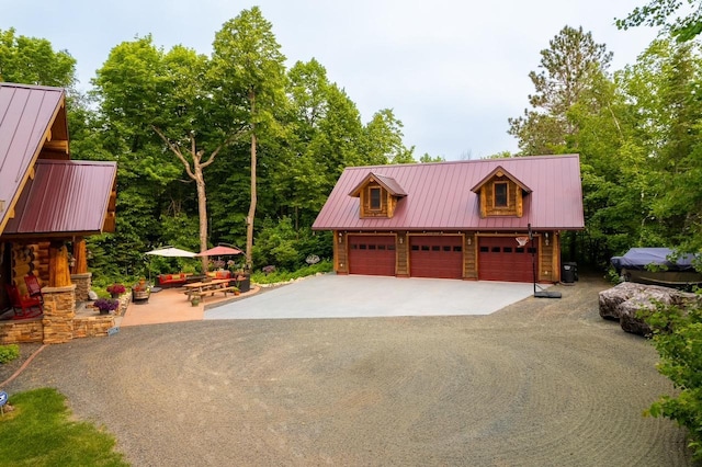 garage with aphalt driveway