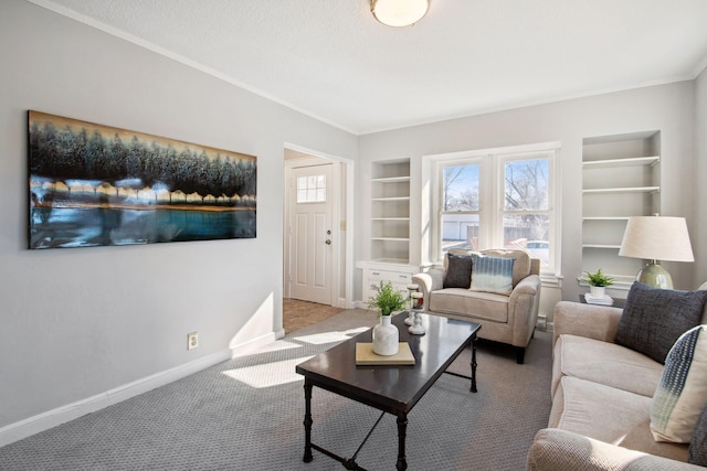 living area featuring built in shelves, crown molding, carpet flooring, a textured ceiling, and baseboards