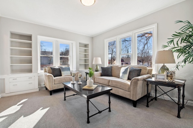 living area featuring carpet floors and built in shelves