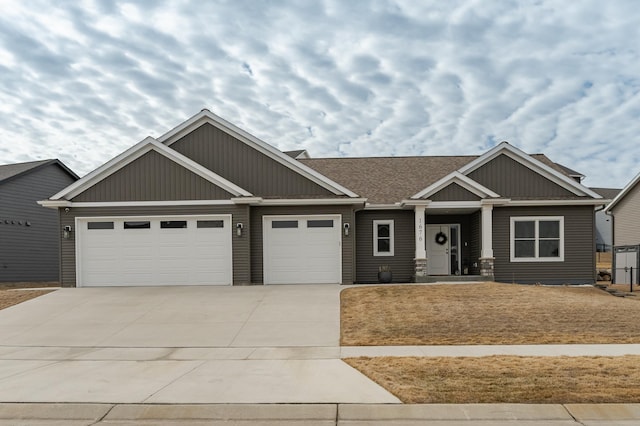 1676 Brandt Dr NE, Byron, MN 55920 - craftsman-style house featuring a garage, driveway, and a shingled roof