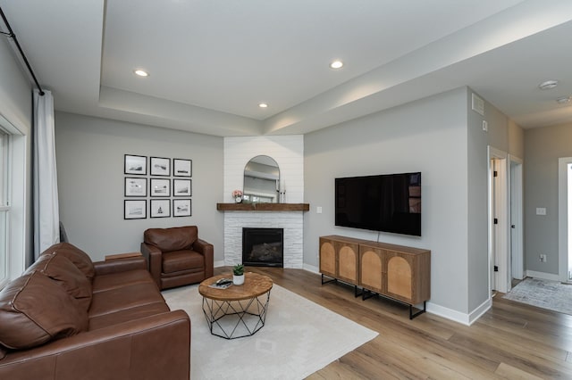 1676 Brandt Dr NE, Byron, MN 55920 - living room featuring a fireplace, recessed lighting, baseboards, and light wood-type flooring