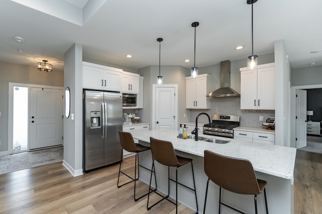 1676 Brandt Dr NE, Byron, MN 55920 - kitchen featuring light wood finished floors, a sink, stainless steel appliances, wall chimney exhaust hood, and tasteful backsplash