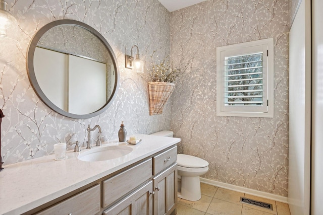 bathroom with wallpapered walls, visible vents, and tile patterned floors