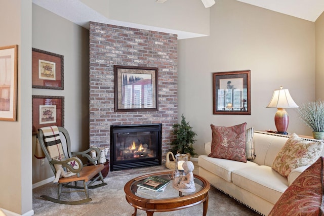 living room featuring a brick fireplace, carpet, and baseboards