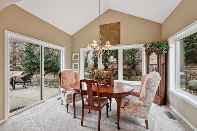 dining area with light colored carpet, visible vents, vaulted ceiling, a chandelier, and baseboards