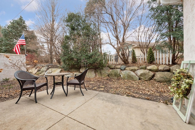 view of patio / terrace featuring outdoor dining area and fence