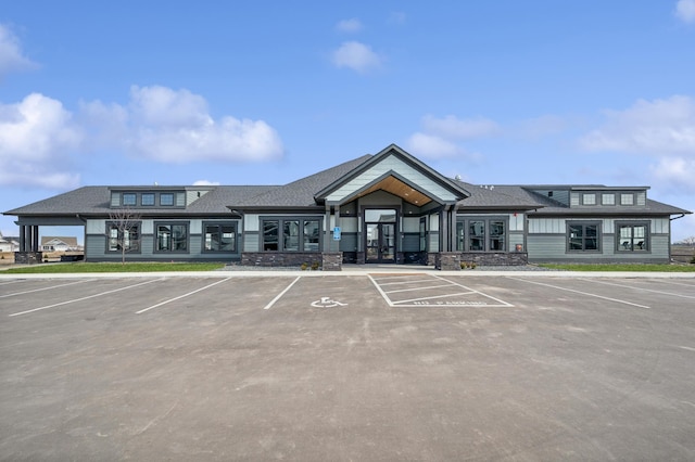 view of building exterior featuring uncovered parking