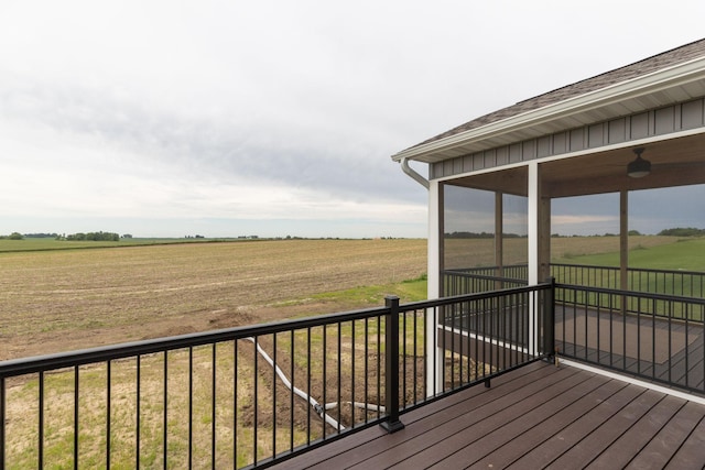 wooden deck with a rural view