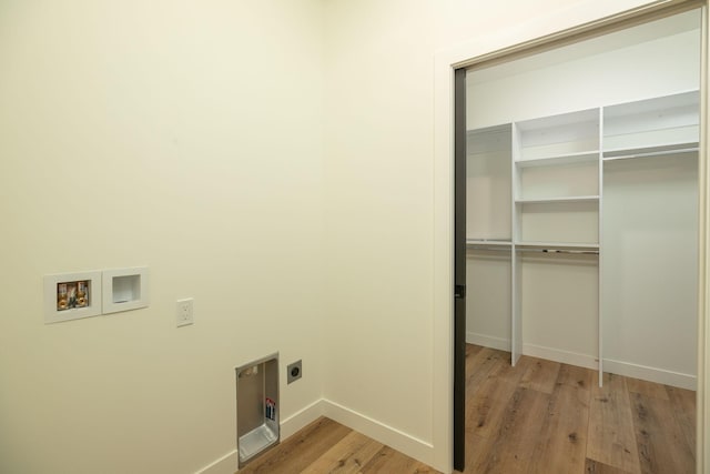 washroom with laundry area, light wood finished floors, baseboards, washer hookup, and electric dryer hookup