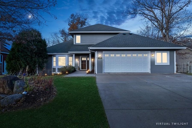 traditional-style home featuring a front lawn, fence, roof with shingles, concrete driveway, and an attached garage