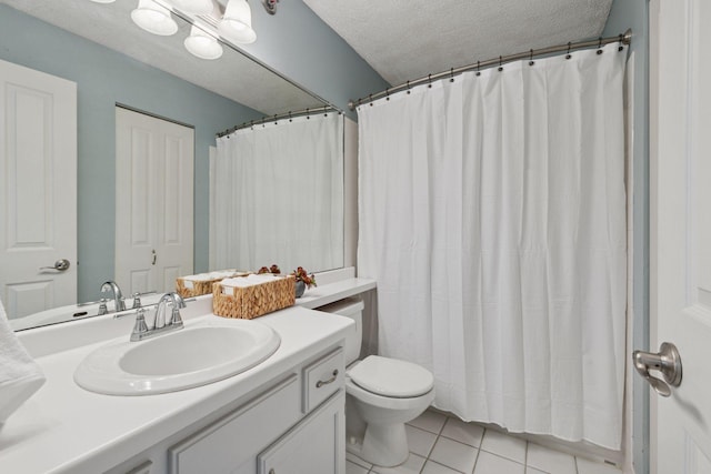 bathroom featuring a shower with shower curtain, toilet, a textured ceiling, vanity, and tile patterned flooring