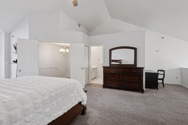 carpeted bedroom with vaulted ceiling, connected bathroom, and ceiling fan with notable chandelier