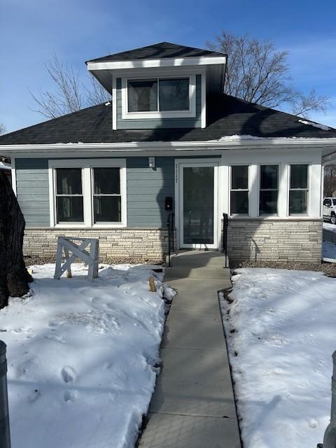 view of front of home featuring stone siding