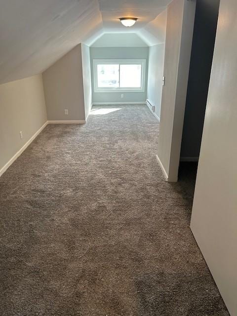 bonus room with vaulted ceiling, baseboards, and carpet floors