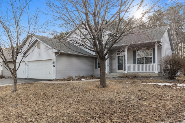 single story home featuring covered porch, an attached garage, driveway, and roof with shingles