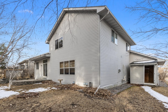 view of side of home with central AC