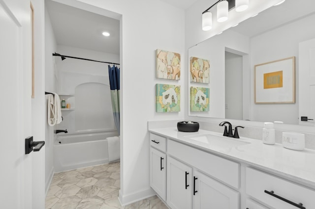 bathroom with baseboards, shower / bathtub combination with curtain, and vanity